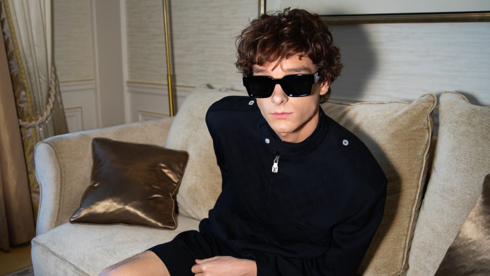 Mason Thames gets ready for the Louis Vuitton SS26 show.