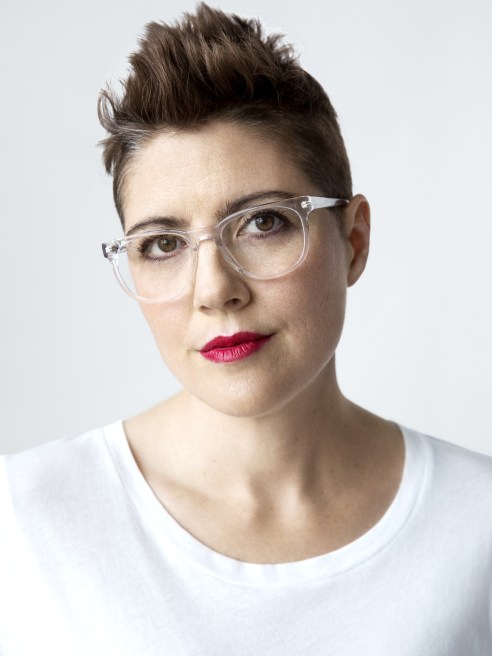 Christine Hunsicker wearing glasses and white top.