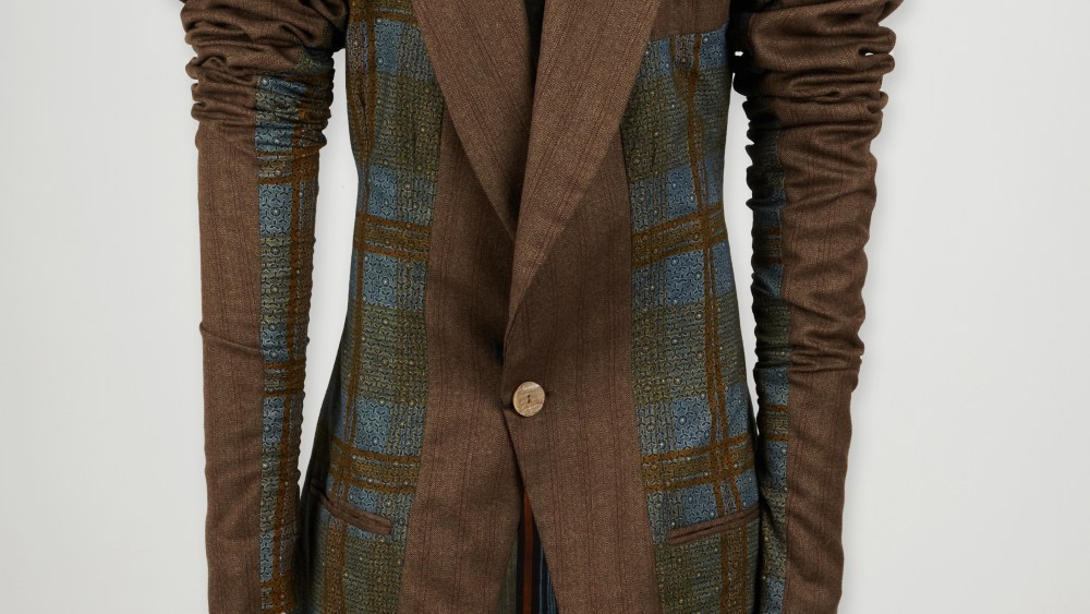 A tailcoat from John Galliano's first collection in 1985 from Elton John's wardrobe.