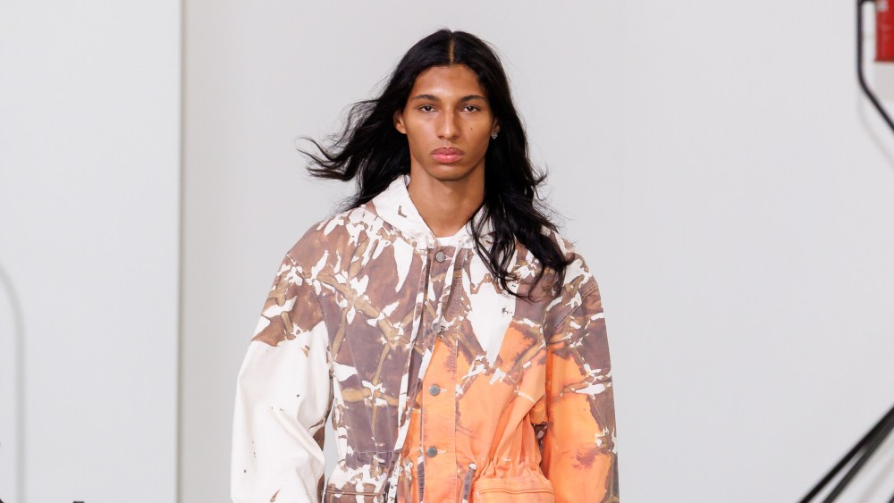 A model wears a look from Etudes Studio's Spring 2026 collection on the runway at Paris Fashion Week.