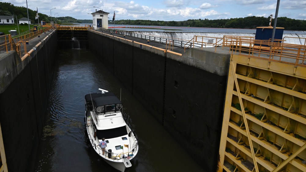 The Ella Victoria of Rexford heads through Lock 7 of the Erie Canal on the Mohawk River in Niskayuna, N.Y.