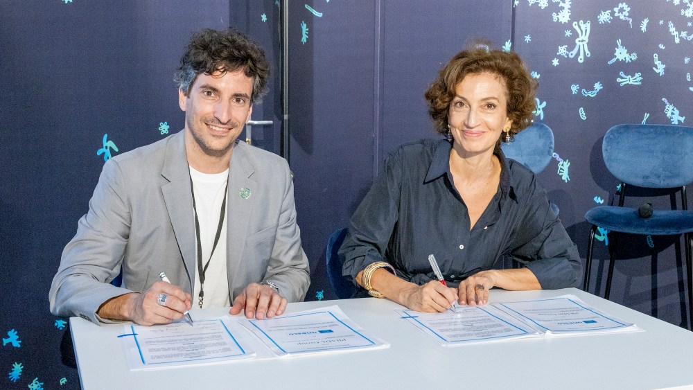 Prada Group's Lorenzo Bertelli, head of CSR and Audrey Azoulay, UNESCO’s director general signing the Sea Beyond Multi-Partner Trust Fund for Connecting People and Ocean in Nice, France.
