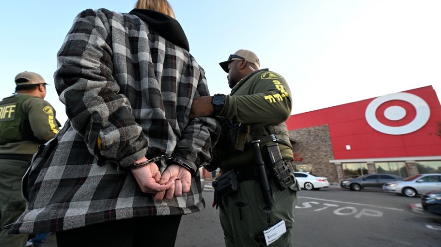 Members of the Riverside County Sheriffs Department detain and search a suspected shoplifter in March.