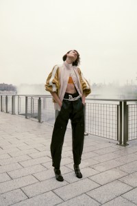 Louis Vuitton draped leather bomber jacket; Dries Van Noten polyamide bra top; Dior pants; Adam Lippes and Brandon Maxwell belts; Courrèges shoes; Thom Browne socks; Hermès 18-karat gold Chaine d’ancre Danae earrings.A