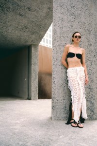 Montce ribbed terry bikini top; Diotima handmade crochet skirt; Tom Ford sunglasses; Hermès shoes; Khaite gold earrings.A