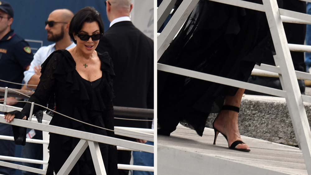 Kris Kardashian in classic black dress sandals and a ruffle dress arriving in Venice for the wedding of Jeff Bezos and Láuren Sanchez.
