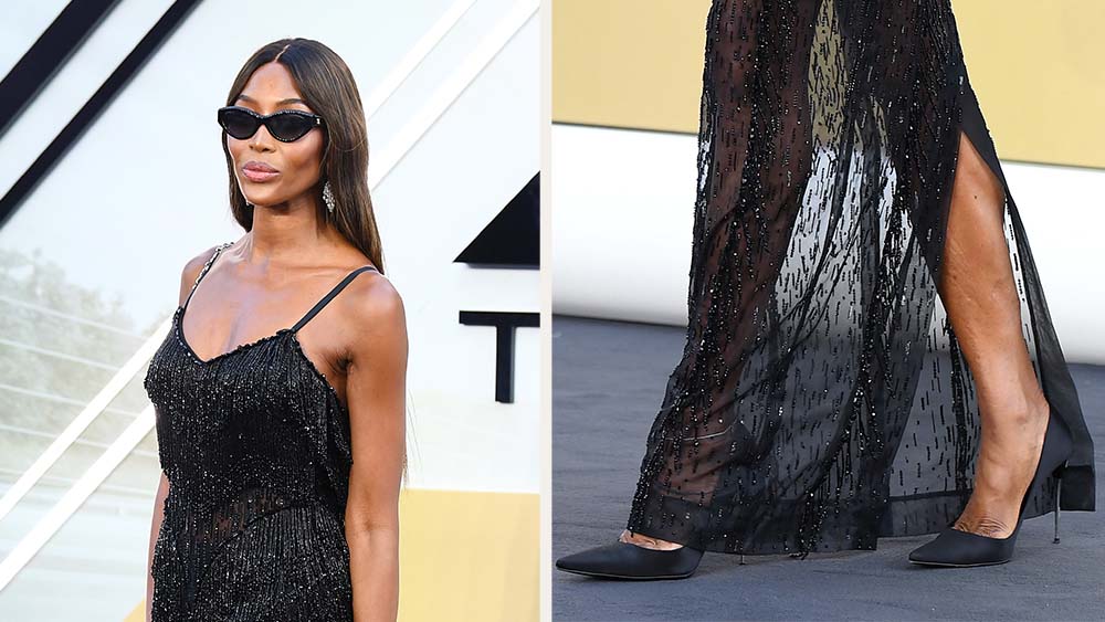 Naomi Campbell attends the "F1: The Movie" European Premiere wearing black satin pumps on June 23, 2025 in London.