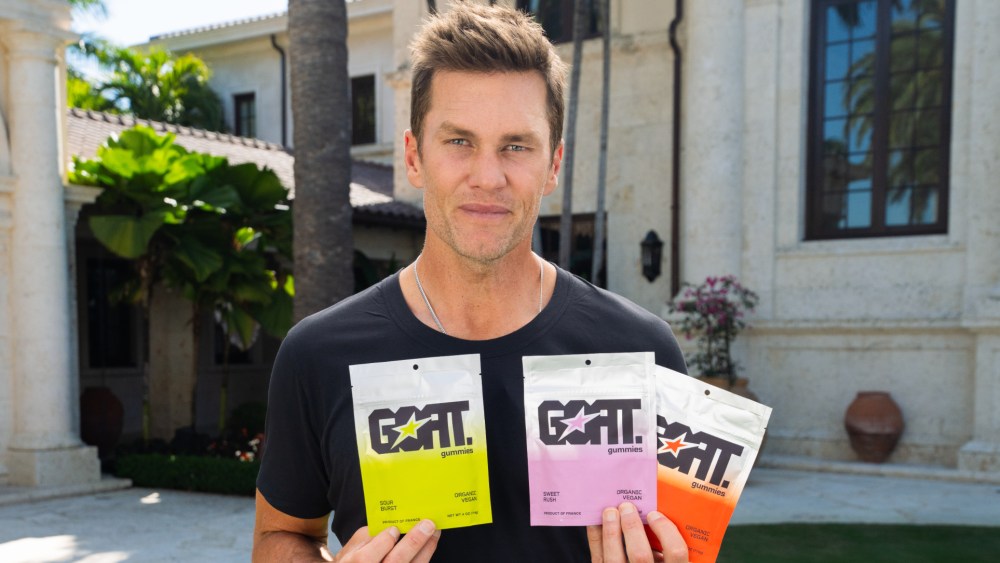 Tom Brady promoting his new GOAT Gummies snack line.