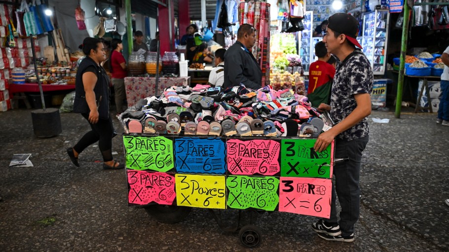 A vendor sells socks at La Terminal market in Guatemala City on July 18, 2025. (Photo by Johan ORDÓÑEZ / AFP)