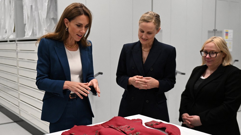 The Princess of Wales meeting Senior Fashion and Textiles Curator, Oriole Cullen, and Director of Collections Care and Access, Kate Parsons, during a visit to the V&A East Storehouse in June.