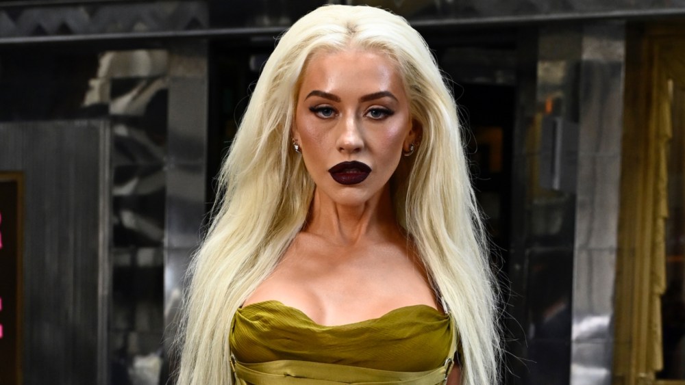 Christina Aguilera dons dark glam for the "Burlesque: The Musical" photocall in London.