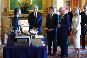 WINDSOR, ENGLAND - JULY 8: France's President Emmanuel Macron (3R) and his wife Brigitte Macron (R), alongside Britain's King Charles III (2R), view an exhibition of art from the Royal Collection exhibition, in the Green Drawing Room at Windsor Castle on July 8, 2025 in Windsor, England. President Emmanuel Macron and Mrs Brigitte Macron visit the UK in the first visit State Visit made by France in 17 years. They are staying at Windsor Castle, hosted by King Charles III and Queen Camilla, and a banquet will be held there in their honour. The Macrons will visit Imperial College, and the President will address Parliament during his stay.  (Photo by Benjamin Cremel - WPA Pool/Getty Images)