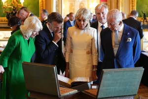 WINDSOR, ENGLAND - JULY 8: King Charles III and Queen Camilla with the President of France Emmanuel Macron and his wife Brigitte Macron view an exhibition of art from the Royal Collection exhibition, in the Green Drawing Room at Windsor Castle on July 8, 2025 in Windsor, England. President Emmanuel Macron and Mrs Brigitte Macron visit the UK in the first visit State Visit made by France in 17 years. They are staying at Windsor Castle, hosted by King Charles III and Queen Camilla, and a banquet will be held there in their honour. The Macrons will visit Imperial College, and the President will address Parliament during his stay.  (Photo by Aaron Chown - WPA Pool/Getty Images)