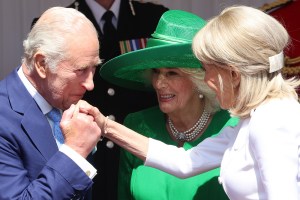 WINDSOR, ENGLAND - JULY 08: Brigitte Macron (R) is received by King Charles III and Queen Camilla at Datchet Road on July 08, 2025 in Windsor, England. President Emmanuel Macron and Mrs Brigitte Macron visit the UK in the first visit State Visit made by France in 17 years. They are staying at Windsor Castle, hosted by King Charles III and Queen Camilla, and a banquet will be held there in their honour. The Macrons will visit Imperial College, and the President will address Parliament during his stay. (Photo by Chris Jackson/Getty Images)