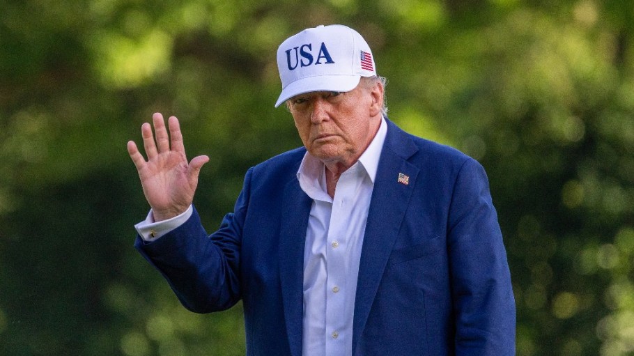 President Donald Trump walks on the south lawn of the White House on Sunday.