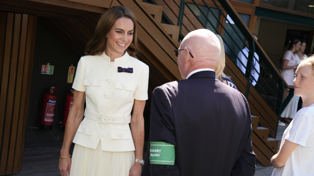 LONDON, ENGLAND - JULY 12: Catherine, Princess of Wales meeting Bob Flint, Wimbledon's longest serving Honorary Steward, as she arrives to attend the Ladies' Singles Final during day thirteen of The Championships Wimbledon 2025 at All England Lawn Tennis and Croquet Club on July 12, 2025 in London, England. (Photo by Jordan Pettitt - WPA Pool/Getty Images)