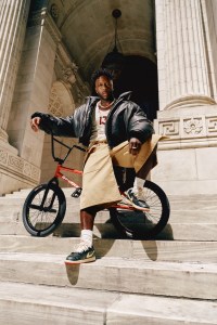 Juun.J cow leather jacket over Acne Studios cotton tank top; Agbobly cotton shorts; Nigel Sylvester x Air Jordan 1 Low Better With Time; Nigel’s own jewelry.