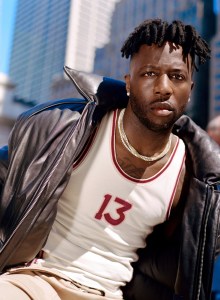 Juun.J cow leather jacket over Acne Studios cotton tank top; Agbobly cotton shorts; Nigel Sylvester x Air Jordan 1 Low Better With Time; Nigel’s own jewelry.