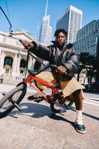 Juun.J cow leather jacket; Agbobly cotton shorts; Nigel Sylvester x Air Jordan 1 Low Better With Time; Nigel’s own jewelry.