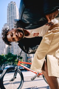 Juun.J cow leather jacket over Acne Studios cotton tank top; Agbobly cotton shorts; Nigel Sylvester x Air Jordan 1 Low Better With Time; Nigel’s own jewelry.