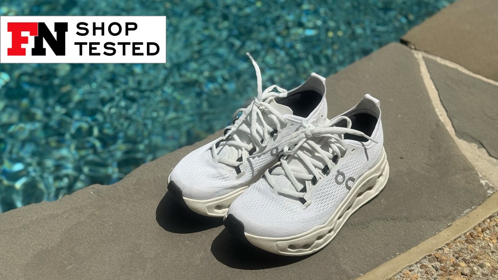 photo of new on cloudsurfer max white sneakers resting next to a pool captured in direct sunlight