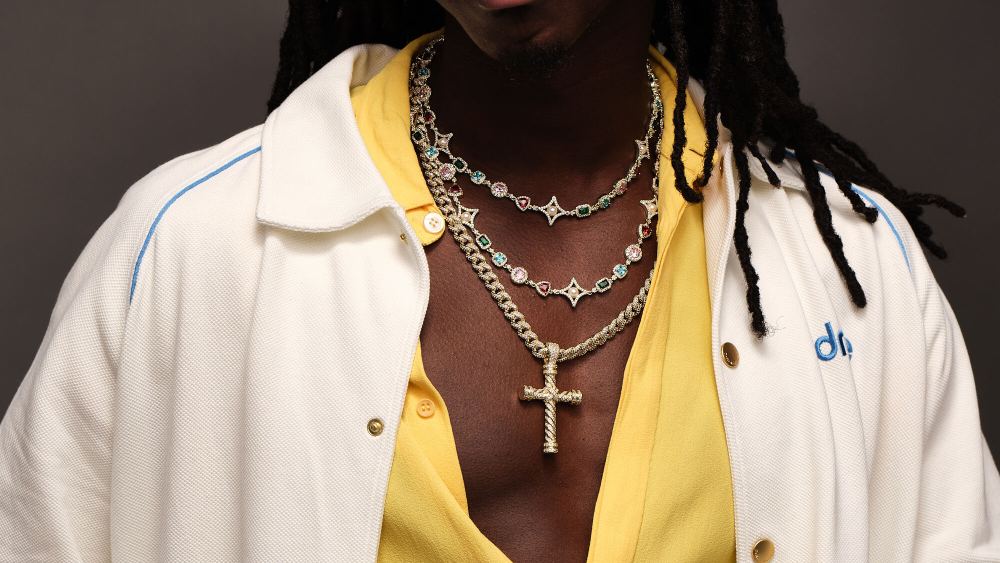 Model wearing necklaces from The Gld Shop