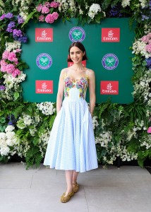 WIMBLEDON, ENGLAND - JULY 6: Lily Collins attends as a guest of Emirates, Official Airline Partner of The Championships, Wimbledon on July 6, 2025 in Wimbledon, England. (Photo by Hoda Davaine/Getty Images for Emirates)