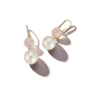 “The ethereal glow of baroque pearls meets the delicate blush of pink topaz — a study in modern romance.”