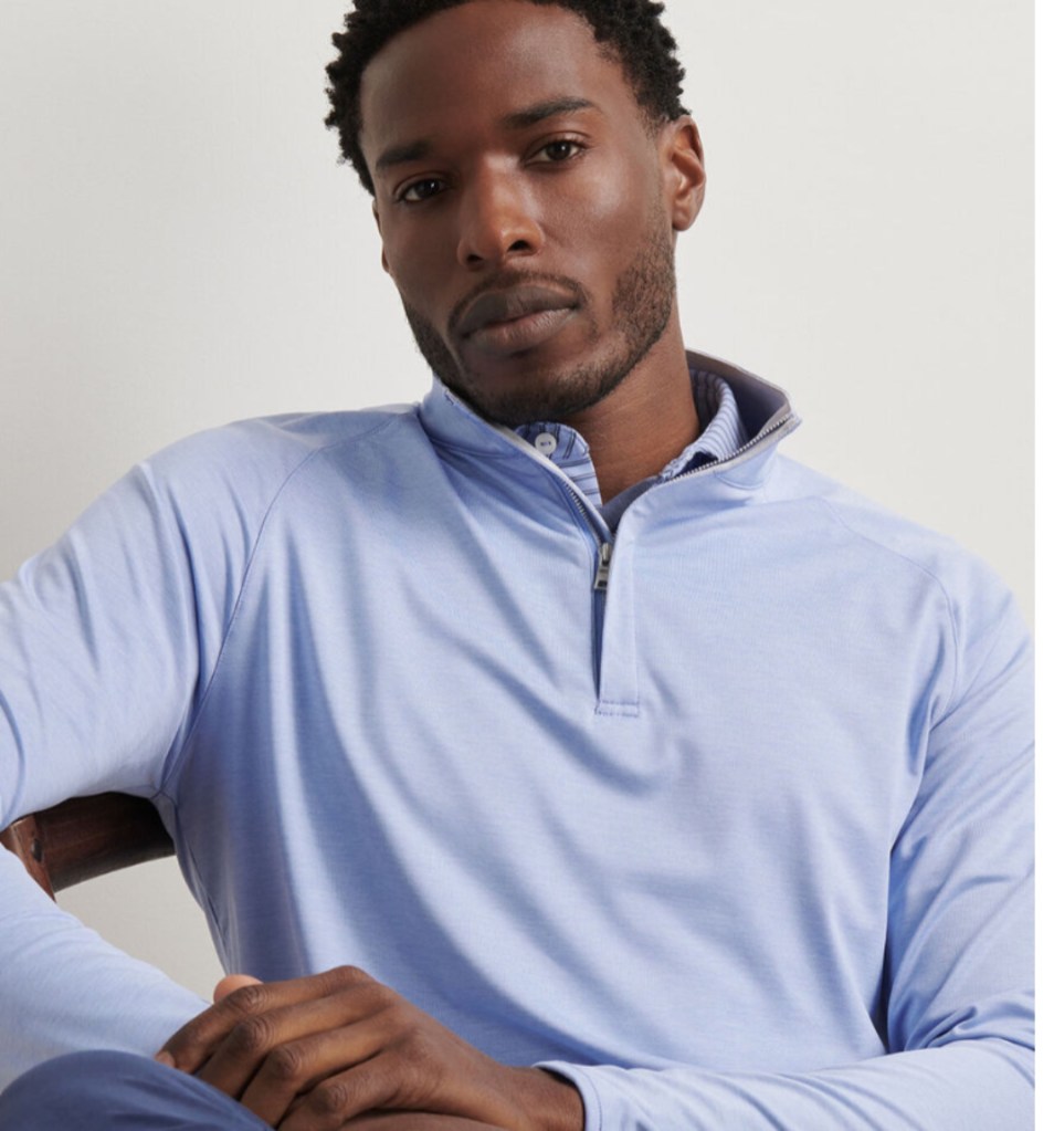 model wearing Peter Millar quarter-zip top