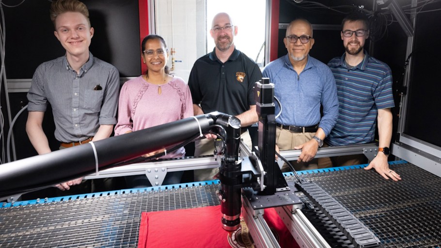 The RIT team behind the new textile recycling system includes, from left, engineers Nick Spears and Sri Priya Das, project lead Mark Walluk, associate professor Abu Islam, and senior staff engineer Ryan Parsons. Their technology—supported by Nike, Goodwill of the Finger Lakes and Ambercycle—uses AI and robotics to disassemble and sort used clothing.