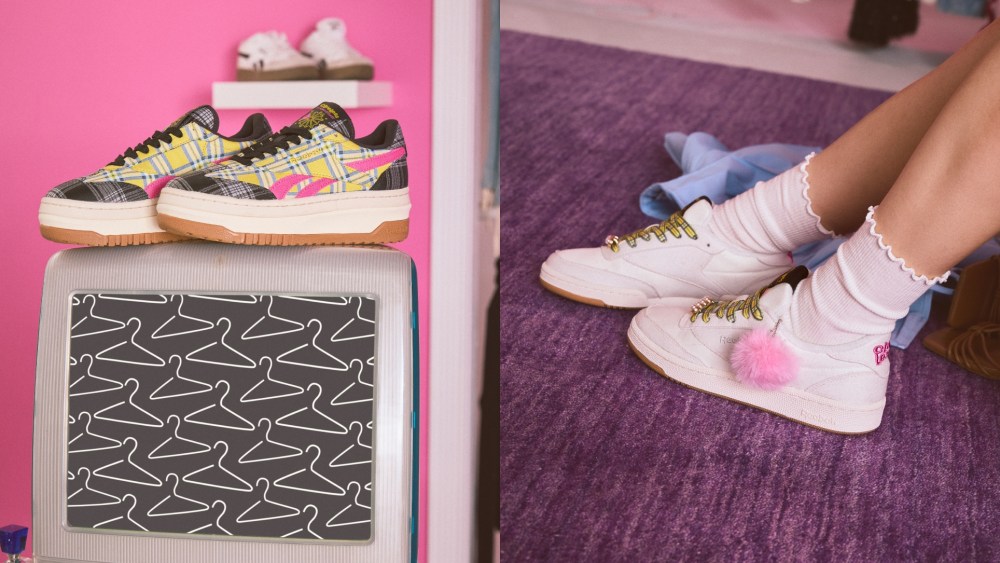 The two pairs of shoes featured in the Reebok x Clueless sneaker capsule. On the left is a platform sneaker with yellow and black plaid in addition to pink side stripes. On the left is a neutral white sneaker with yellow plaid laces and accessories including a pink pom-pom.