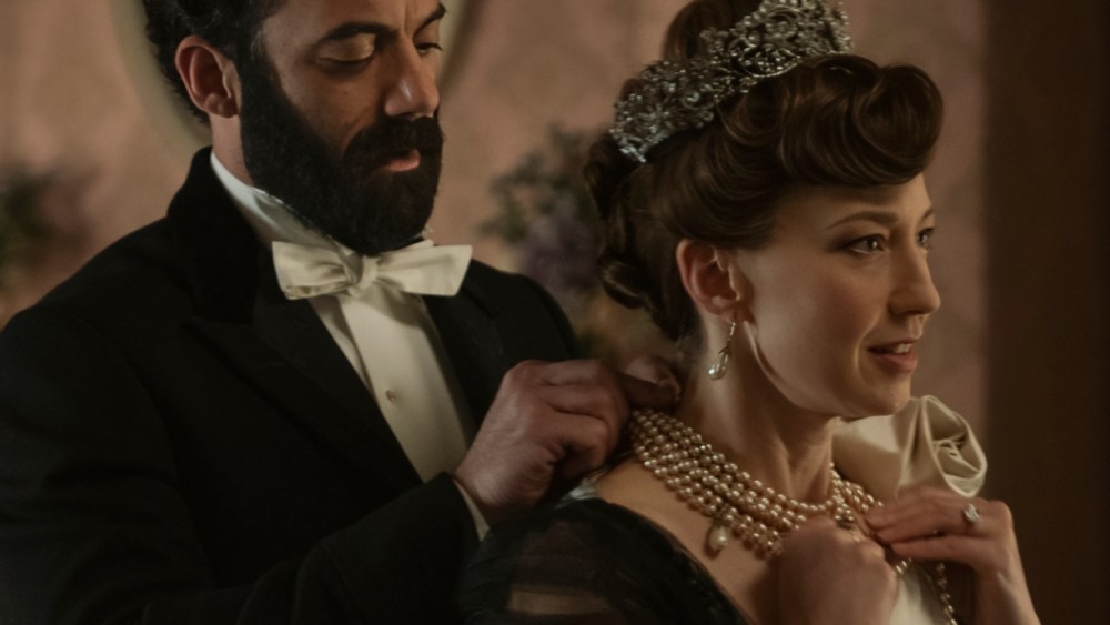 Margan Spector and Carrie Coon in The Gilded Age, Season Three, on HBO Max. Coon is wearing pearl necklace, earrings and a crystal embellished tiara.
