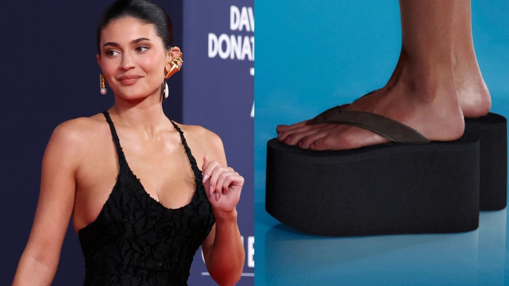 Kylie Jenner wears ERL big flip flop in black.