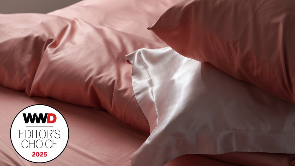 silky pillowcases in a range of pink and white shades resting on top of bed with pink duvet cover and sheets