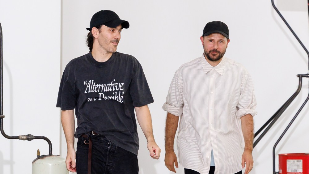 Études Studio creative directors Jérémie Egry and Aurélien Arbet walk the runway after their Paris Fashion Week show in June 2025.