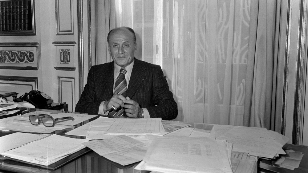 Designer Pierre Balmain poses for portraits in his office on July 10, 1974 in Paris.