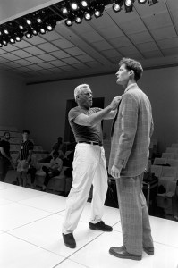 Designer Giorgio Armani directs models during rehearsal in preparation for Giorgio Armani Fall 1988 Ready-to-Wear promotional dinner and fashion show in Los Angeles.