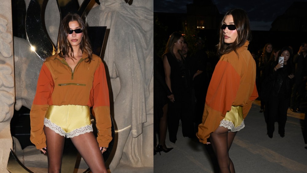 Hailey Bieber wears exposed satin and lace underwear as outerwear for the Saint Laurent spring 2026 ready-to-wear show during Paris Fashion Week on Sept. 29, 2025, in Paris.