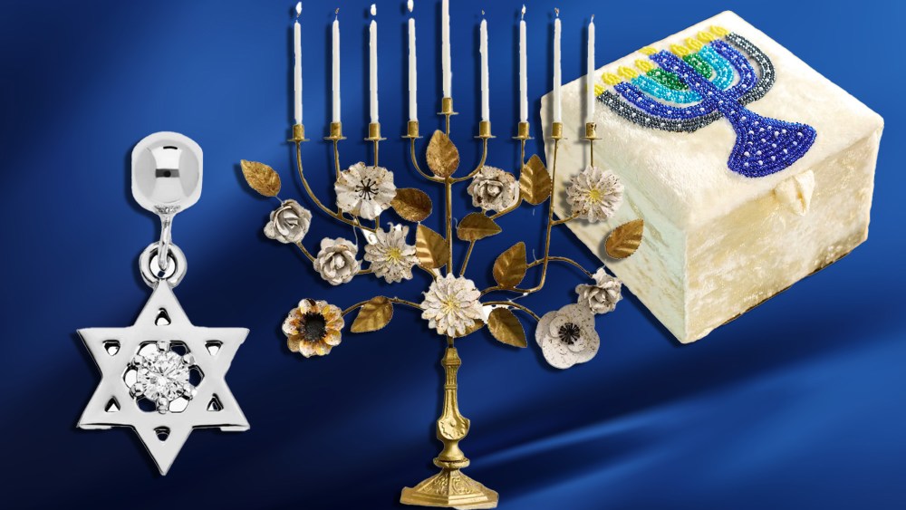 assortment of hanukkah themed items, from a star of david charm to a menorah, over a blue gradient background