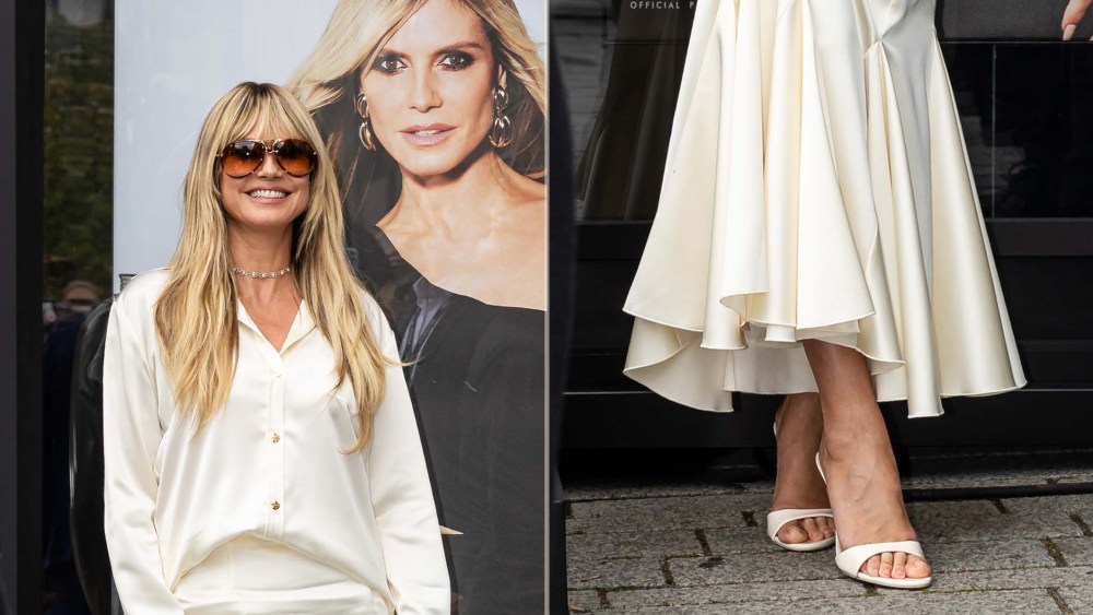 Heidi Klum wears white minimalist mules at the  L’Oréal pop-up in Düsseldorf on Tuesday.