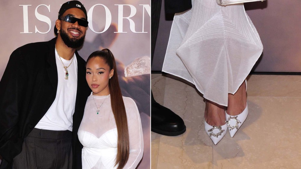 Jordyn Woods wearing Amina Muaddi Begum slingback heels alongside Karl-Anthony Towns at Jared Jewelers' 'A Diamond is Born' film premiere on Wednesday evening.