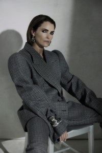 Acne Studios wool jacket and pants; Martha Calvo 14-karat gold plate earrings; Khaite Shadow bracelet in silver, and Sydney Garber 18-karat white gold dome cuff.