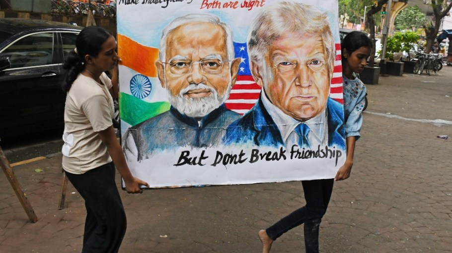 Students at an art school in Mumbai with a poster of Modi and Trump.