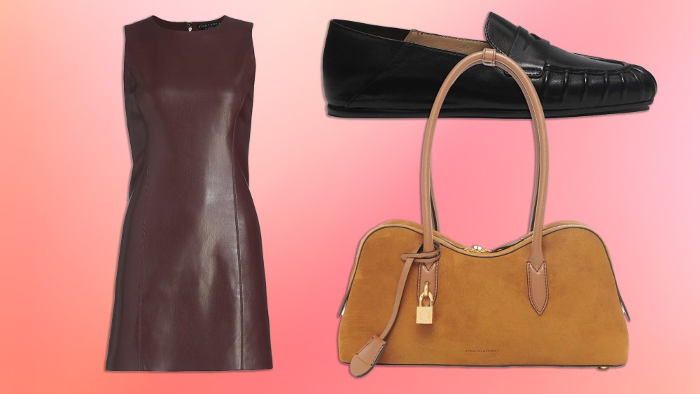 a leather dress, loafers, and suede handbag arranged over a gradient pink background