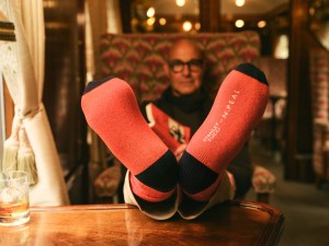 Stanley Tucci in the campaign for N. Peal’s new Art of Travelling collection.
