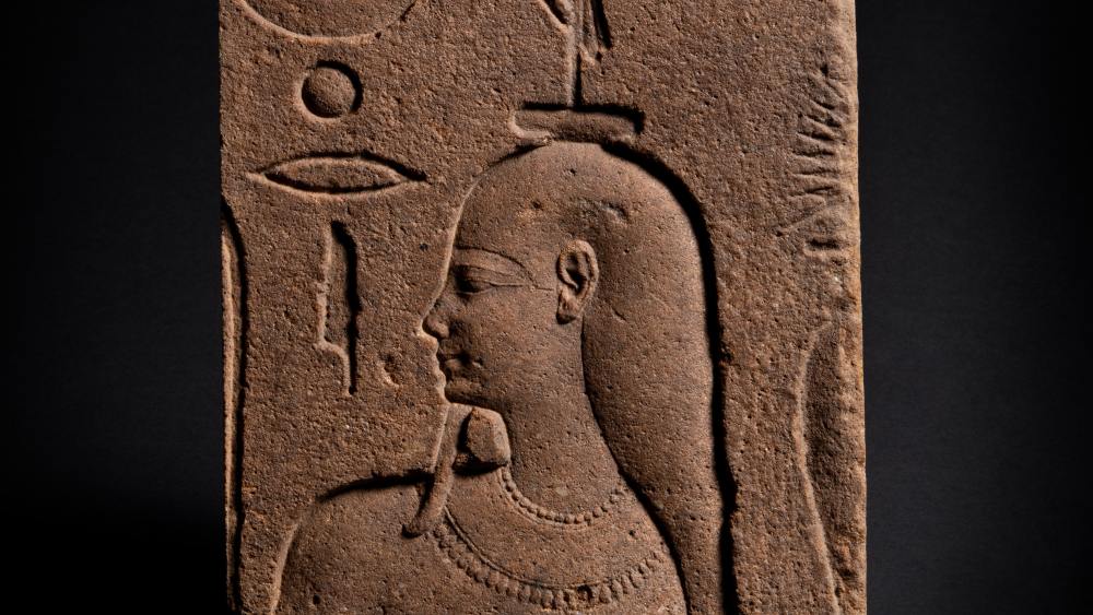 A rare Egyptian quartzite relief from the early Ptolemaic period, circa 332 BC. Once covered in varnish or wax, it now sparkles like gold.