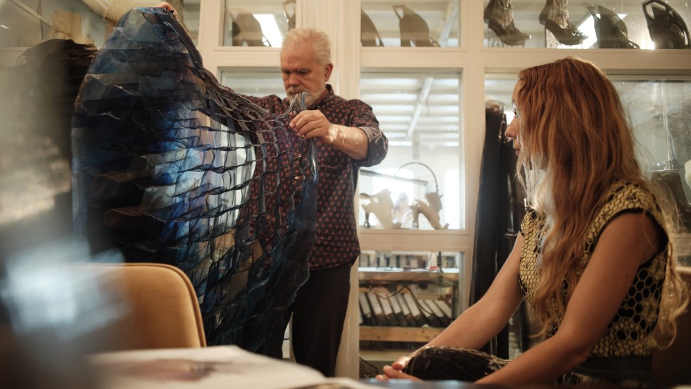 Marc Happel and Iris Van Herpen inspecting a costume for the New York City Ballet fall fashion gala 2025.
