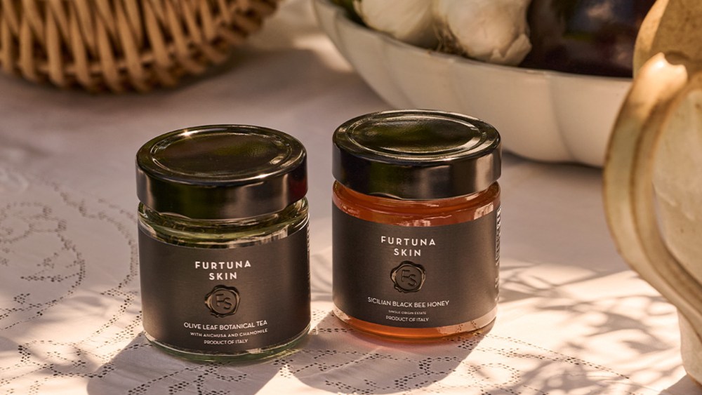 Furtuna Skin's new botanical tea and Sicilian honey duo in a tablescape.