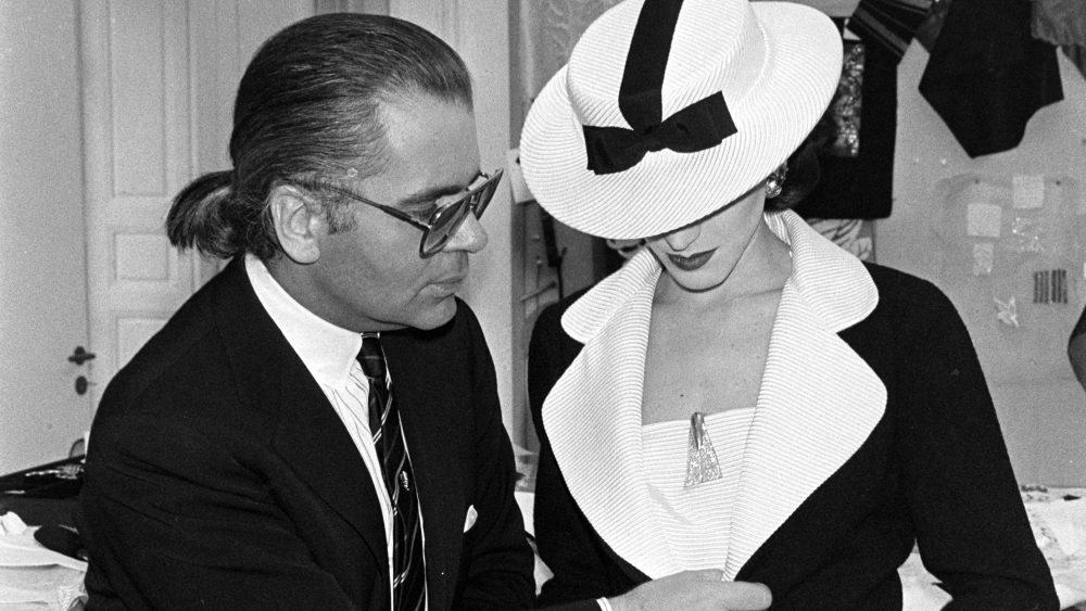 Designer Karl Lagerfeld previews his first couture collection for Chanel before the runway show on January 25, 1983.