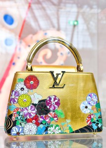 The Louis Vuitton stand at Art Basel Paris featuring artworks and handbag designs by Takashi Murakami.